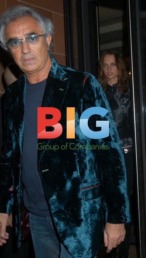Renault Boss Flavio Briatore Leaves Restaurant with Woman