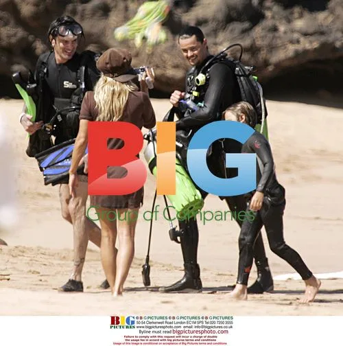 Pamela Anderson Relaxes on Beach in Hawaii