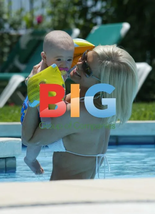 Suzanne Shaw Plays in Pool with Child
