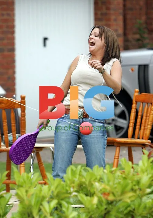 Kerry Katona playing swing tennis