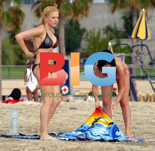 Glamour models Jo Hicks and Sophie Howard on beach