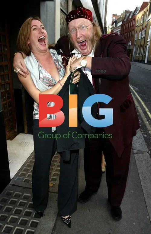 John Mccririck shares laugh, peeks at friend's breast
