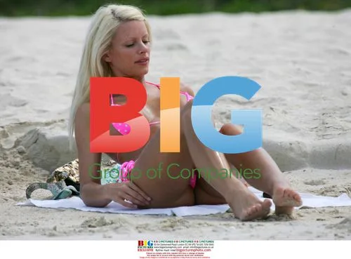Model Emma B plays in the sea with inflatable ring