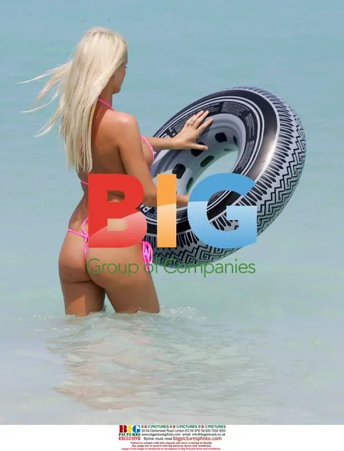 Emma B plays in the sea with rubber ring