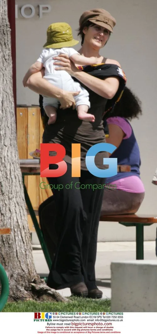 Carrie-Anne Moss with baby in Malibu
