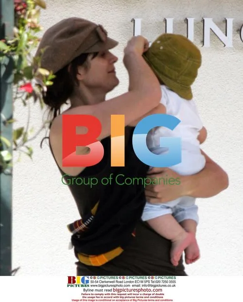 Carrie-Anne Moss with baby in Malibu