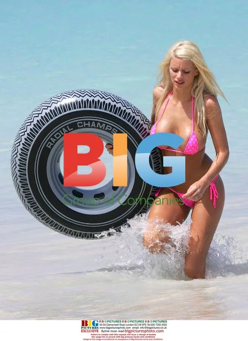 Model Emma B plays in the sea