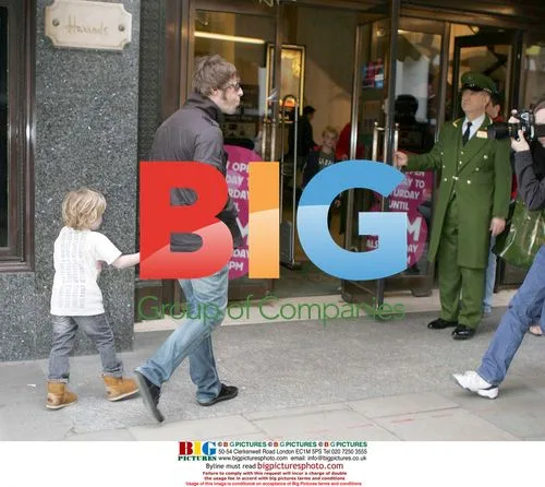 Liam Gallagher Spits at Paparazzi with Son