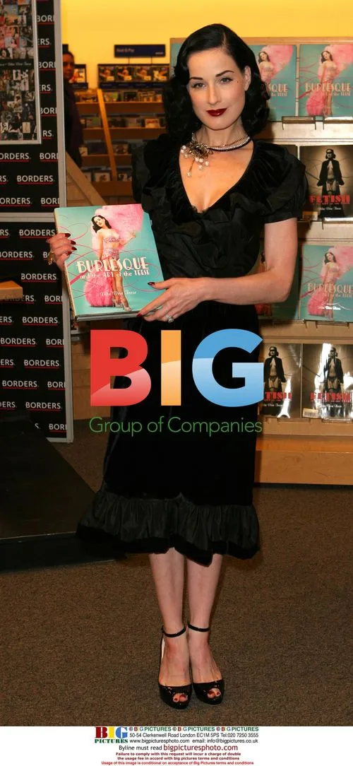 Dita von Teese signs book