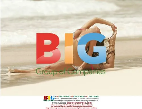 Glamour girl Coralie practicing yoga on beach