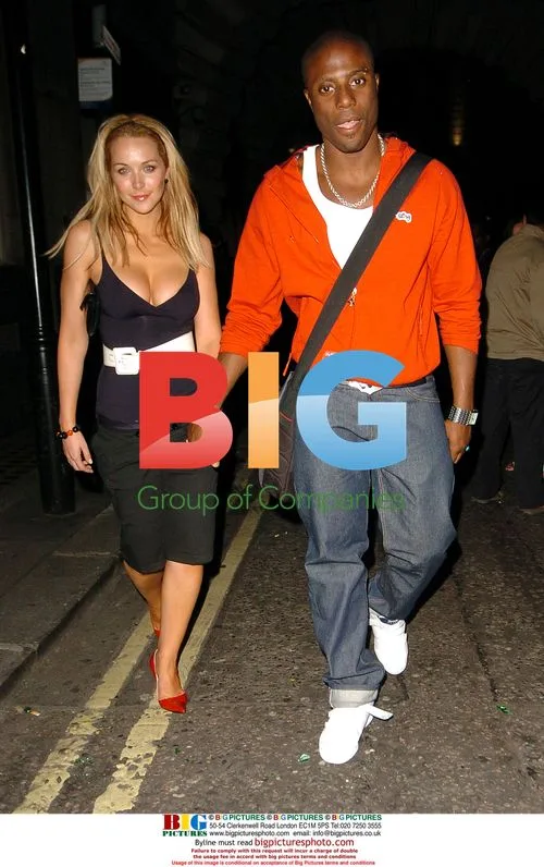 Streets member Leo Ihenancho and girlfriend leave London club