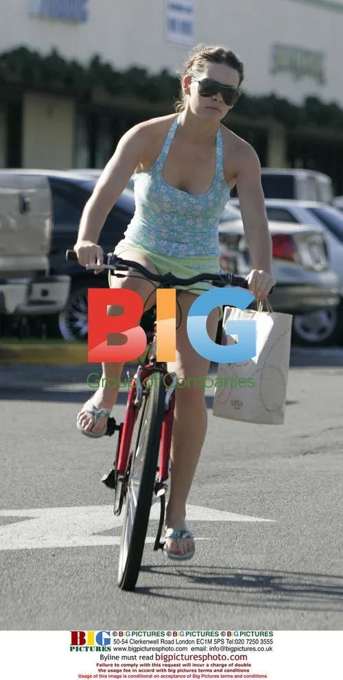 Evangeline Lilly shops on bike in Hawaii