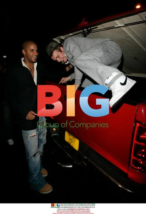 Ricky Whittle helps Chris Fountain into his truck