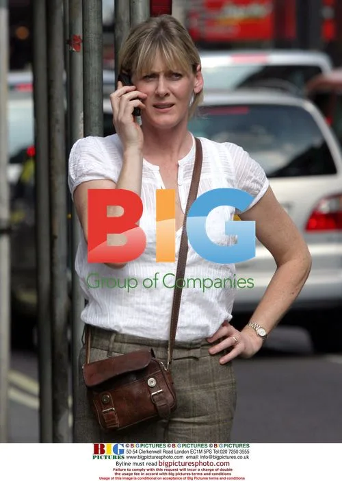 Sarah Lancashire hails taxi in London