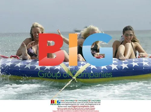 Page 3 models enjoy water sports in Barbados