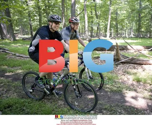 Bush and Rasmussen bike at Camp David