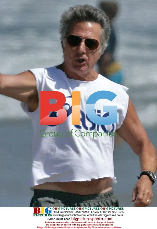 Dustin Hoffman walks his dogs on the beach