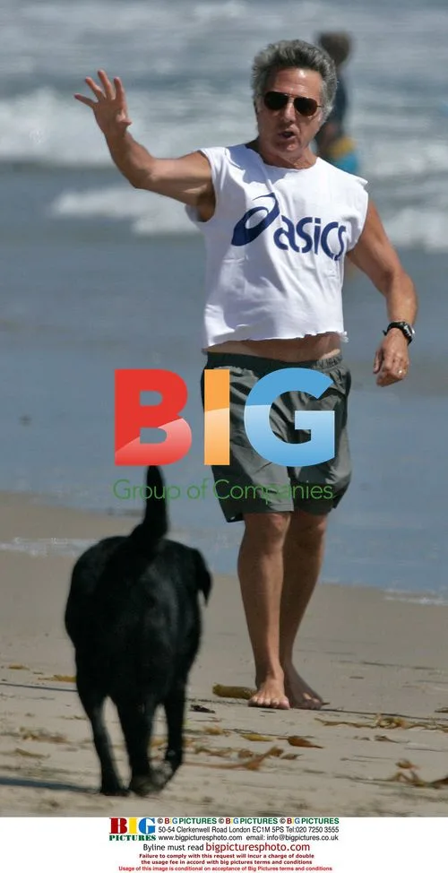 Dustin Hoffman walking his dogs on the beach
