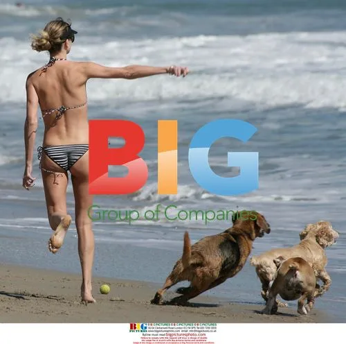 Charlize Theron relaxes on Malibu beach