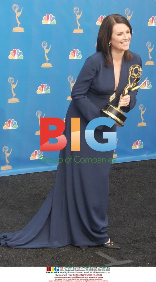Megan Mullally Holds Emmy