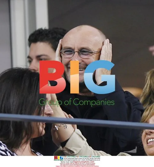 Phil Collins reacts at Andre Agassi's U.S. Open match