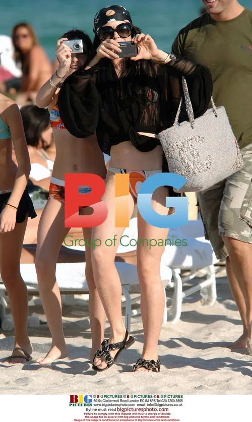 Lindsay Lohan snaps at paparazzi on Miami beach