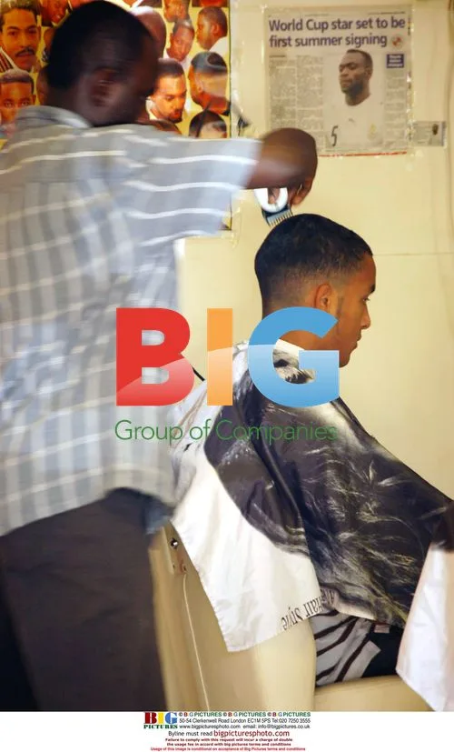 Theo Walcott Gets Haircut in Reading