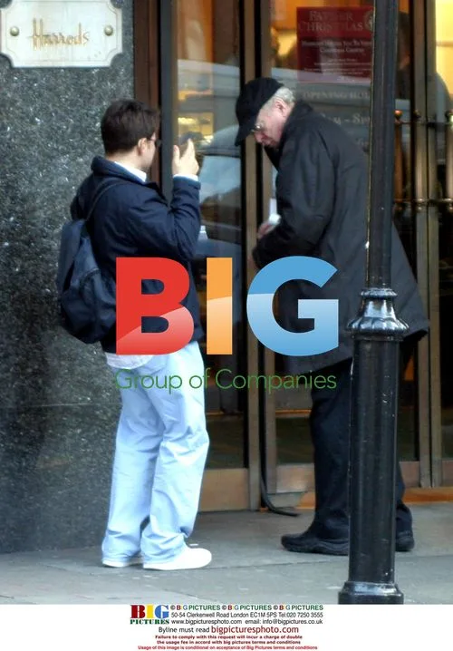 Michael Caine Talks to Beggar at Harrods