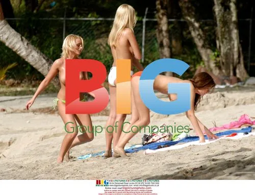 Glamour models chill on Barbados beach