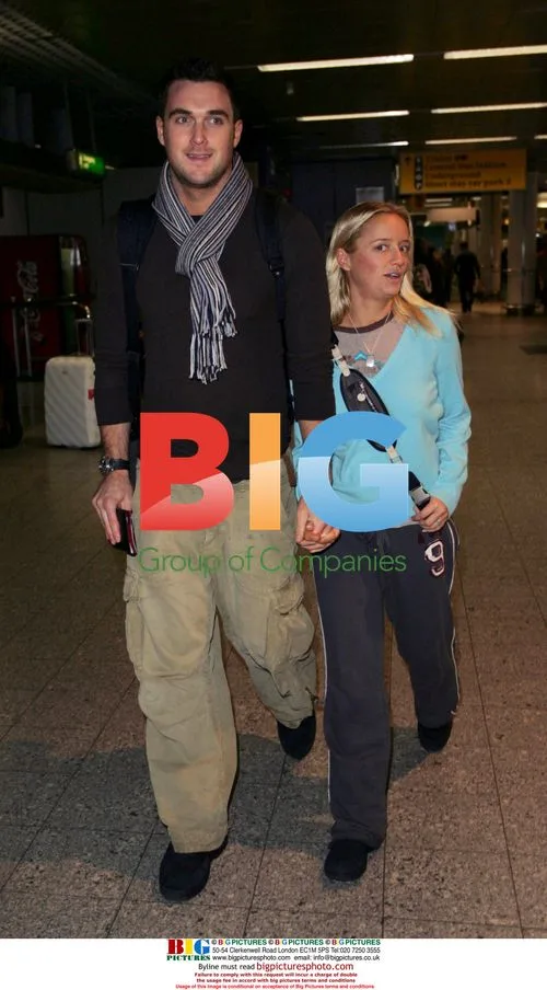 Lucy Davis and Owain Yeoman Depart Heathrow