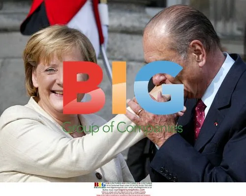 Chirac Kisses Merkel's Hand at Summit