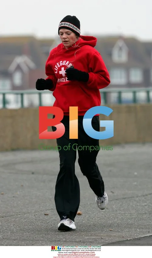 Zoe Ball jogs along Hove sea front