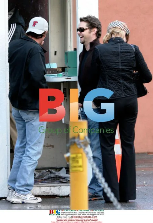 Luke Perry and Jason Priestley wait for car