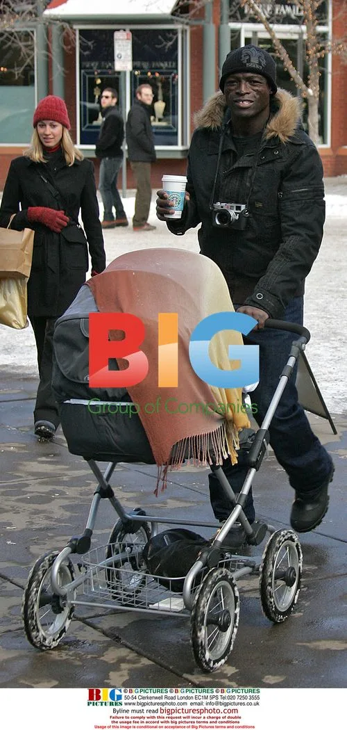 Seal and Heidi Klum with baby in Aspen