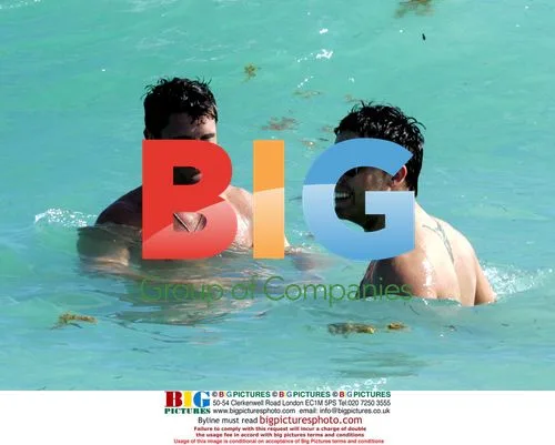 Lance Bass and boyfriend Reichen Lehmkuhl swim in Miami