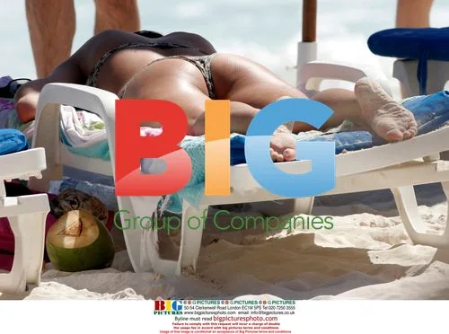 George Clooney's ex and new beau sunbathing in the Caribbean