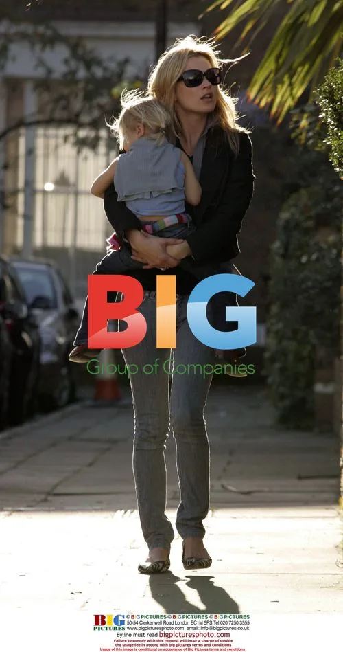 Kate Moss Carries Daughter Lila-Grace