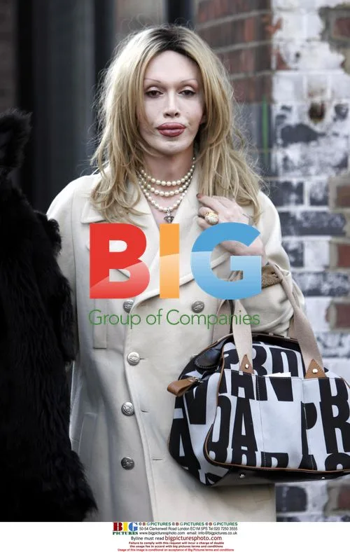 Pete Burns Tries On Rubber Trousers