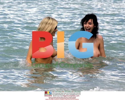 Stunna's Sophie Howard and Charlotte cool down on beach