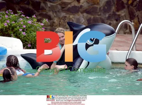 Abi Titmus plays with inflatable Orca in Spain