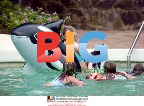 Abi Titmus plays with Orca inflatable in Spain