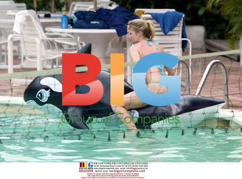 Abi Titmus Plays with Inflatable Whale