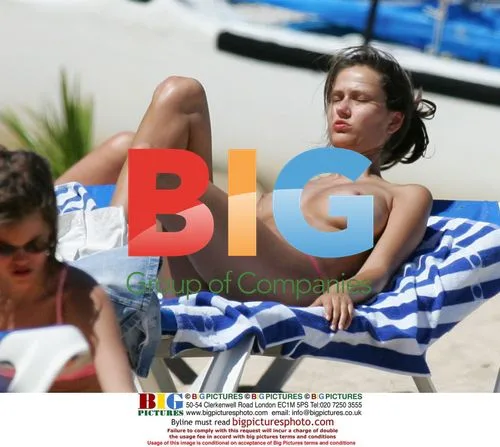 Supermodel Anna Draganska sunbathes topless in St Barths