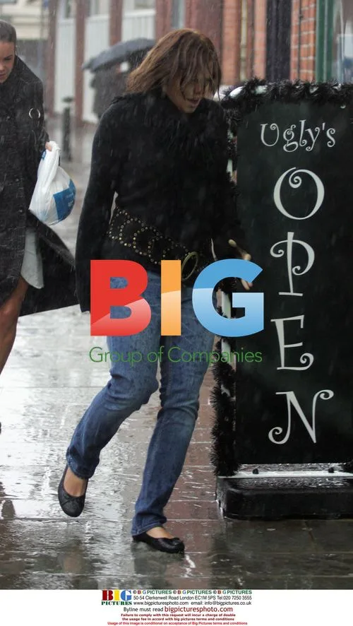 Jade Goody and Carly Walpole Brave Rain to Bank