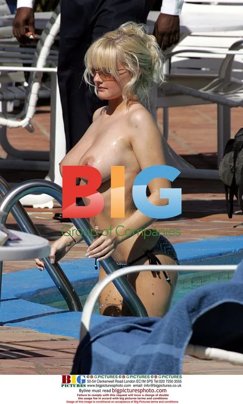Model Michelle Marsh Sunbathing by Pool