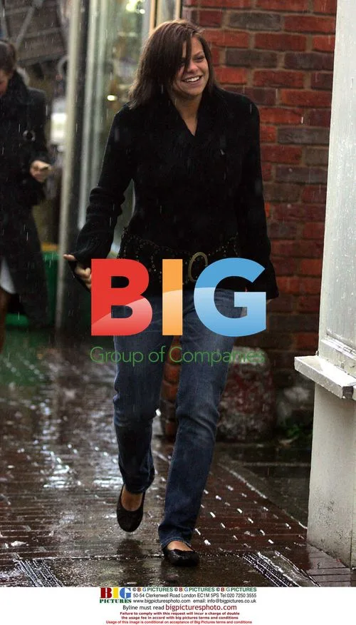 Jade Goody and Carly Walpole Brave Rain for Bank Visit