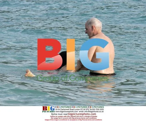 Steve Martin and Kristin Davis on Caribbean beach