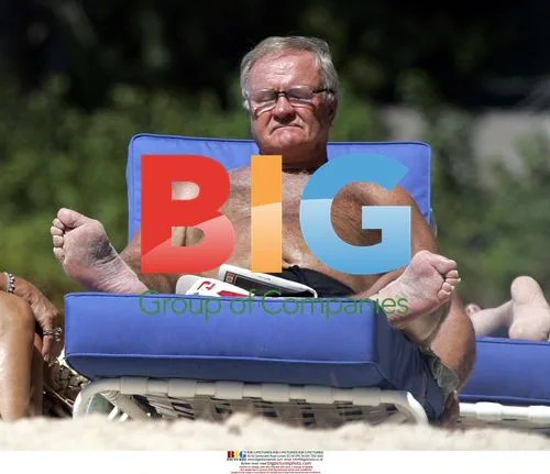 Ron Atkinson relaxing on Barbados beach
