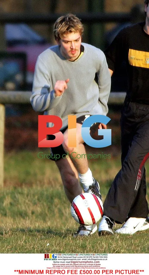 Euan Blair plays football with girlfriend