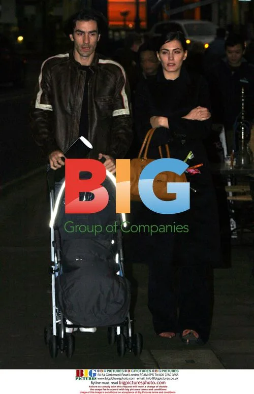 Footballer Robert Pires with girlfriend and baby